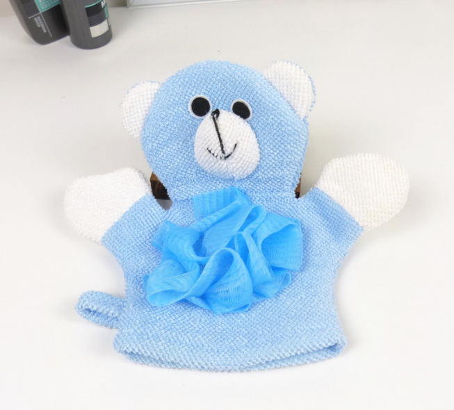 Child's hand wearing blue bear bath mitt glove with soapy lather over a bathtub