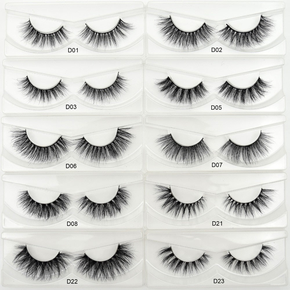 Grid of 10 full strip paired eyelash styles (D01-D08, D21-D23) on white translucent strip packaging