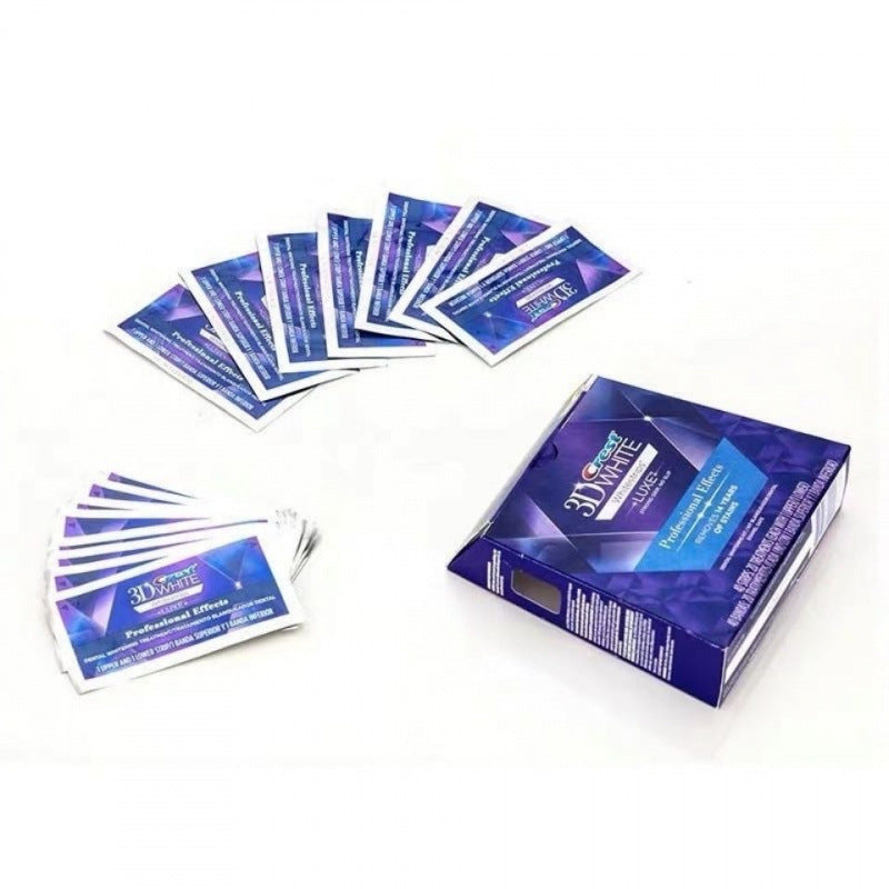 Multiple individual whitening strip packets fanned out with box packaging
