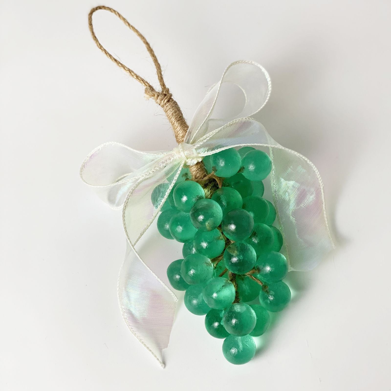 Deep burgundy transparent grape soap with iridescent organza ribbon and natural rope details