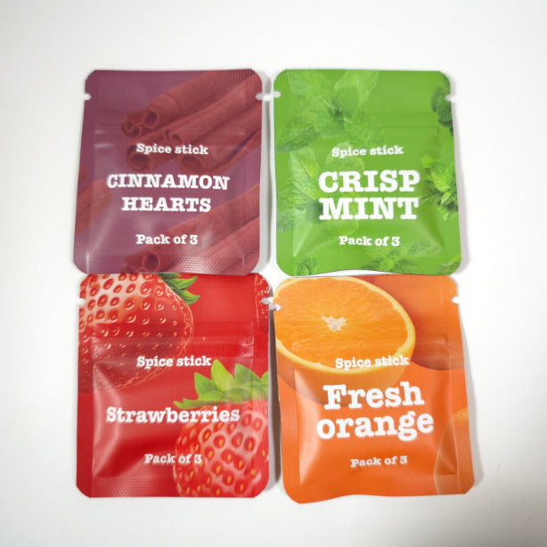 Close-up of Strawberries flavor spice stick pouch showing red foil bag with strawberry imagery