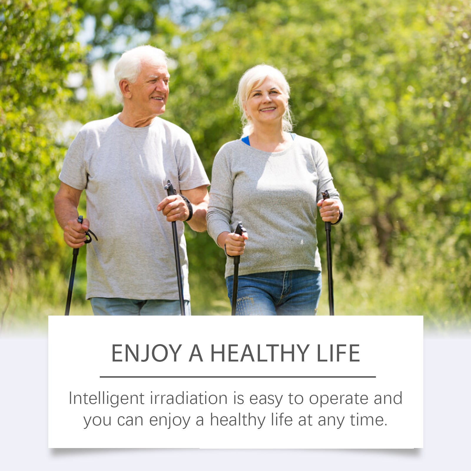 Senior couple walking outdoors in nature with walking poles, smiling together