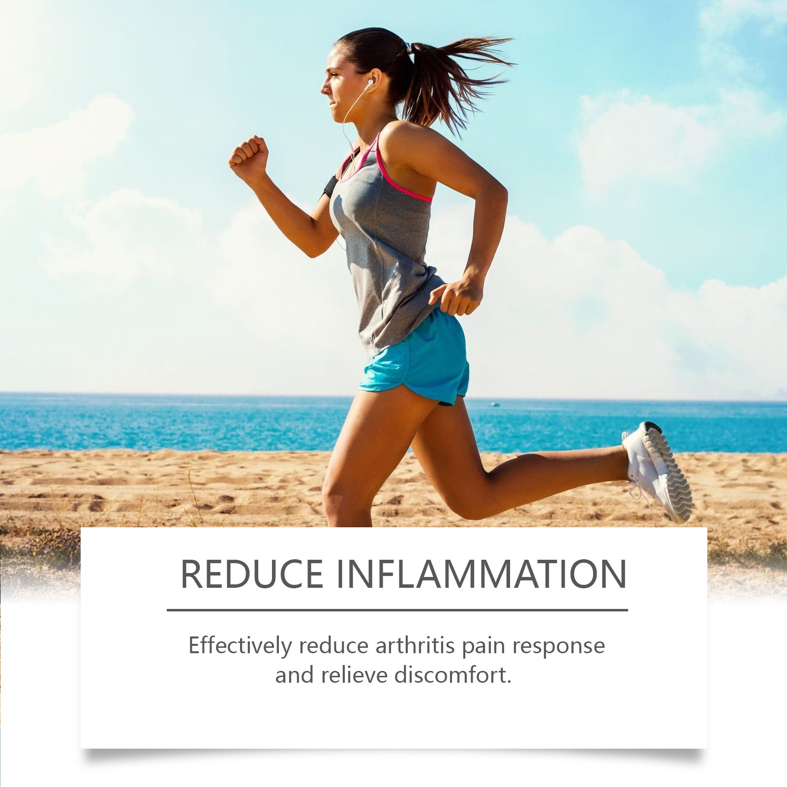 Female athlete running on beach in athletic wear against blue sky and ocean backdrop