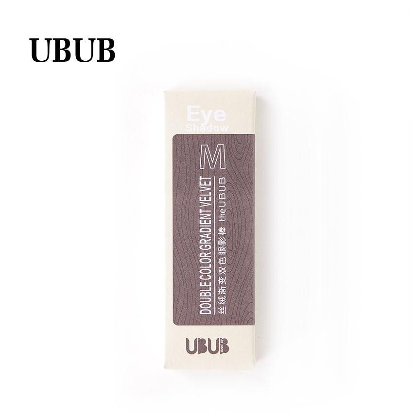 Close-up angled view of extended twist-up eyeshadow stick with chunky shimmer particles visible