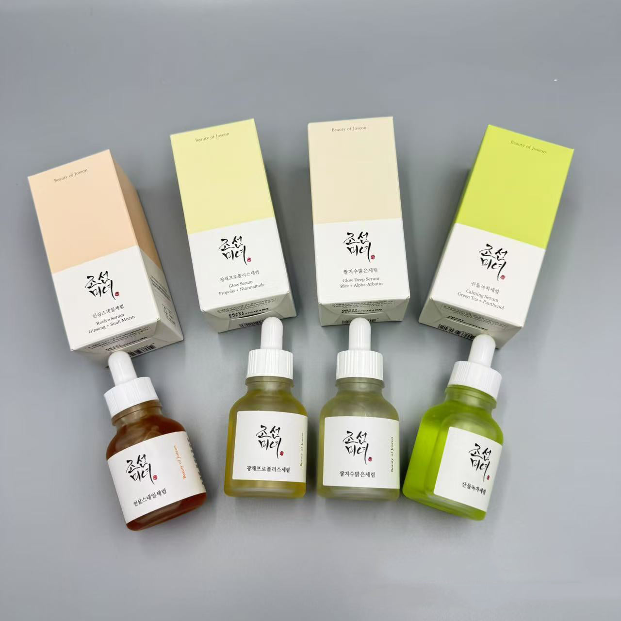 Four targeted serums and their packaging shown individually with ingredient highlights