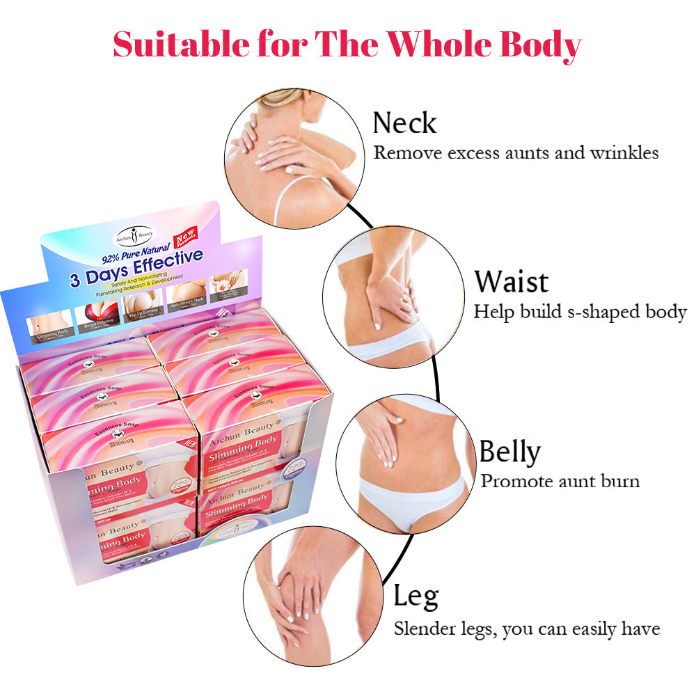 Woman in white sports bra and shorts examining her toned abdomen with hands, displaying sculpted body results alongside packaged Aichun Beauty soap bars and loose product