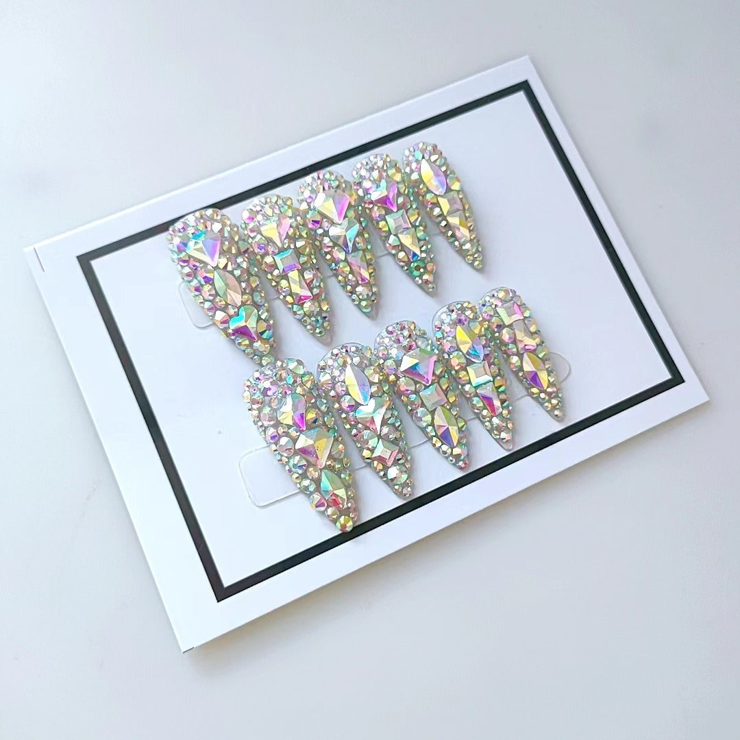 Repeated angle of framed nail set emphasizing 3D dimensional sculpting and prismatic AB crystal detail