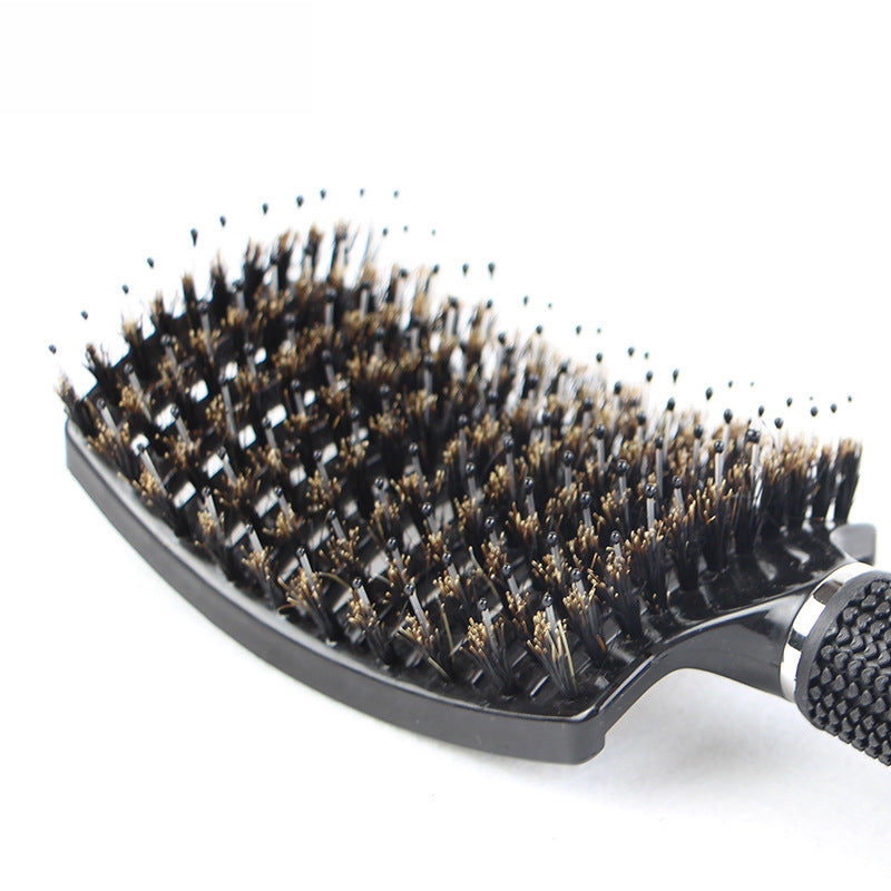 Close-up macro view of brush head showing dense arrangement of nylon and metallic bristles in organized rows