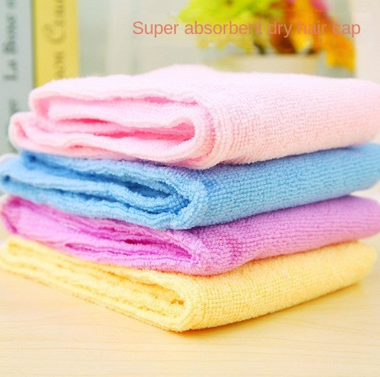 Stack of four folded microfiber hair caps in pink, blue, magenta, and yellow with text overlay 'Super absorbent dry hair cap'