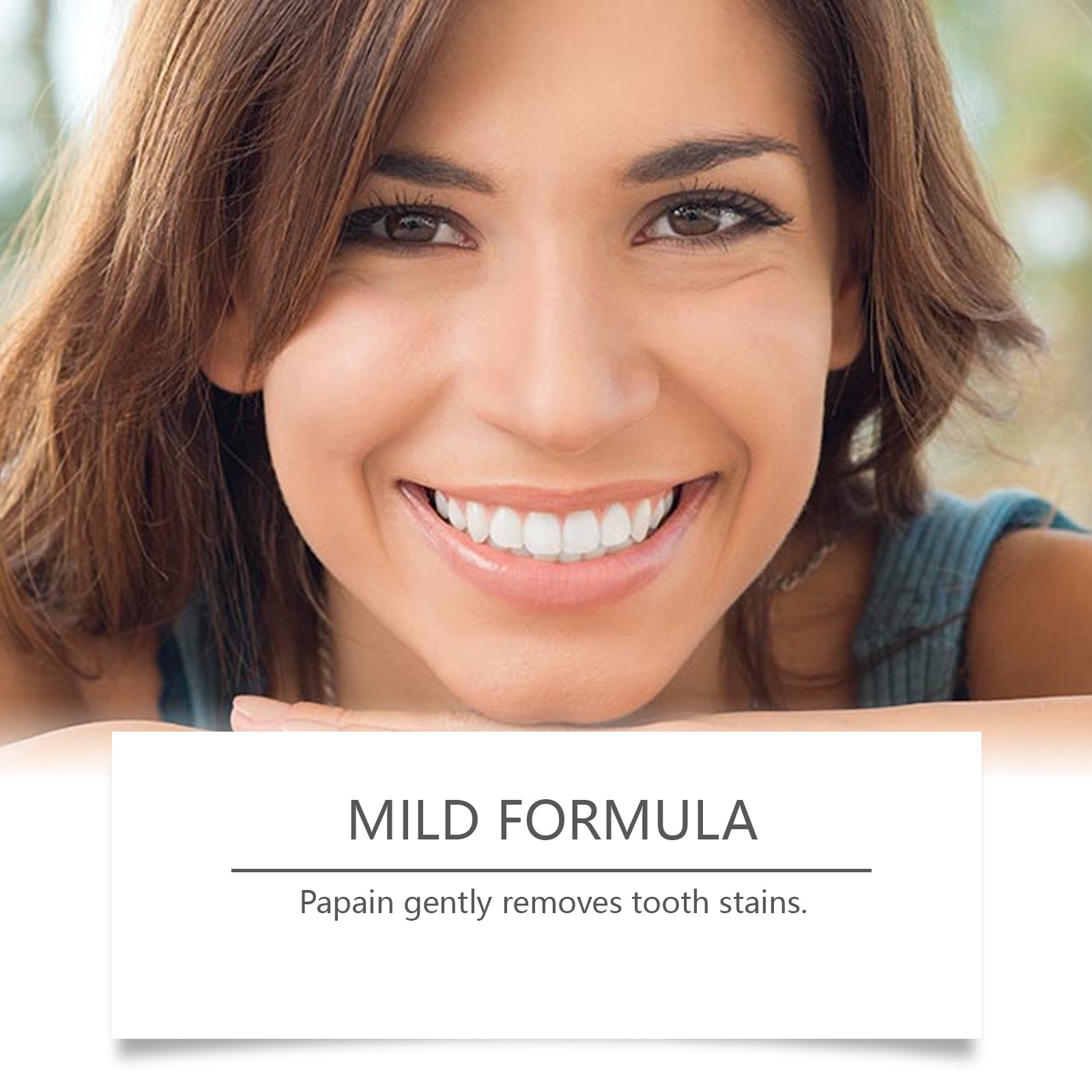 Woman with bright white smile displaying products with confident expression against blue background