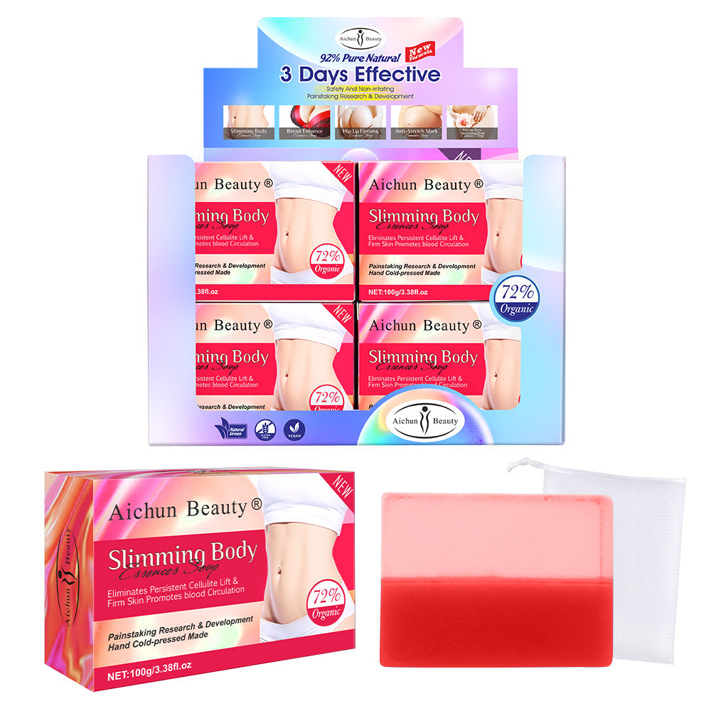 Product display box showing four packaged Aichun Beauty Slimming Body soaps with gradient dual-color design, alongside individual loose soap bars in coral and red ombre, brand certifications visible