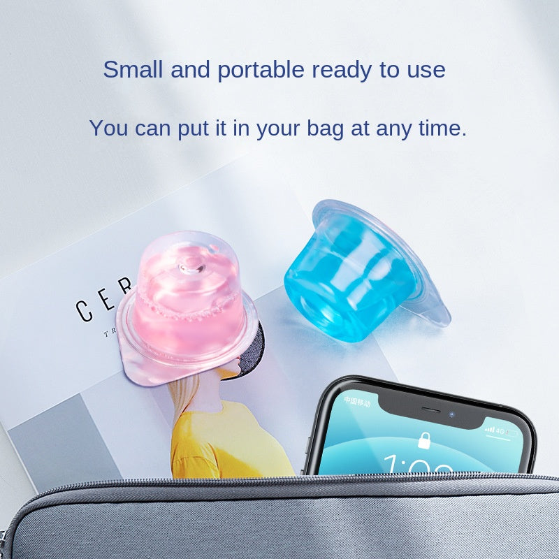 Product shown in lifestyle context within a travel bag alongside phone and accessories, emphasizing compact portable size