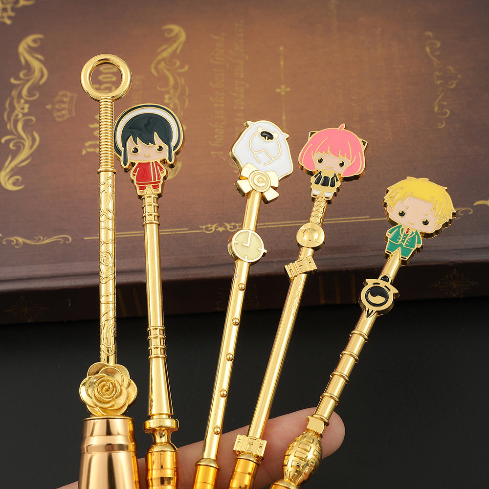 Hand holding five brush handles upward displaying all four anime enamel character charms and sculpted gold handle details