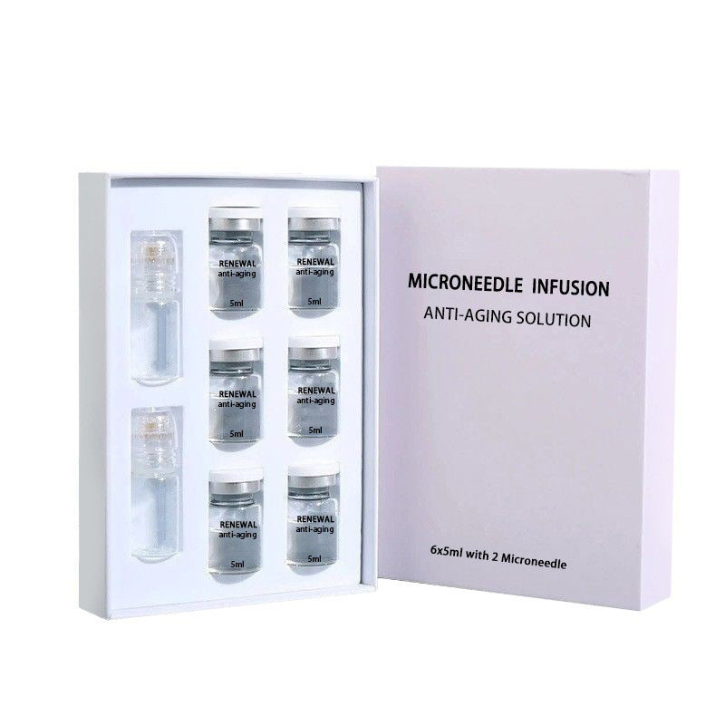 Luxury unboxed presentation showing 6x5ml serum vials with 2 integrated microneedle rollers in professional display