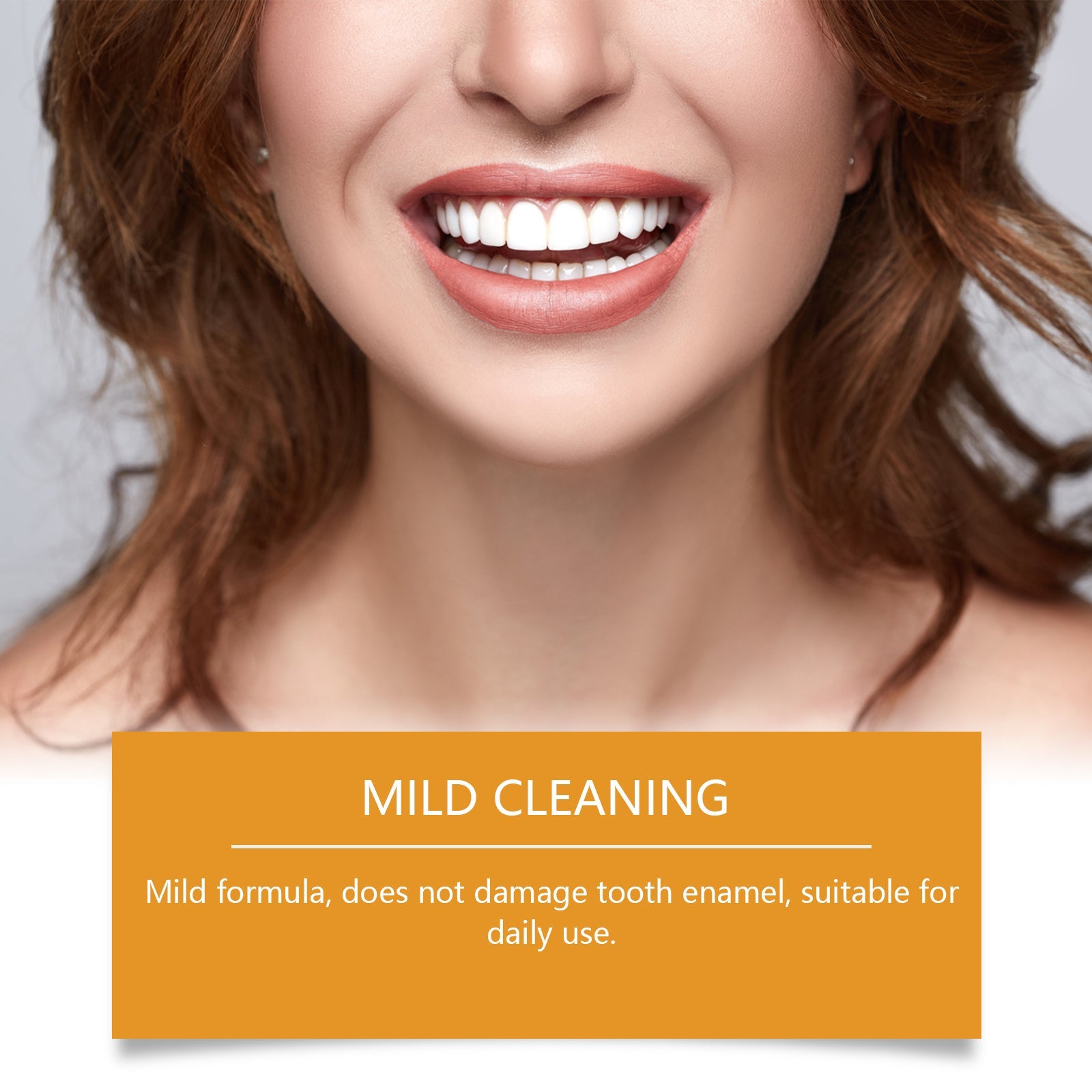 Woman with bright white smile holding toothpaste, gold background with orange stripe