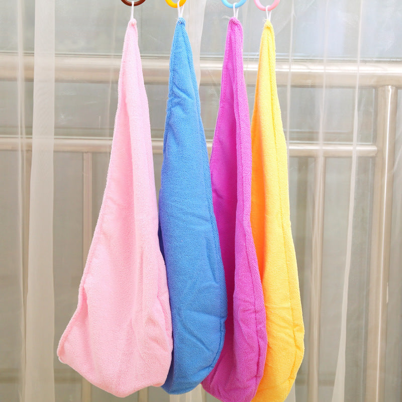 Four hair drying caps hanging from rings on bathroom window rod in pink, blue, hot pink, and yellow