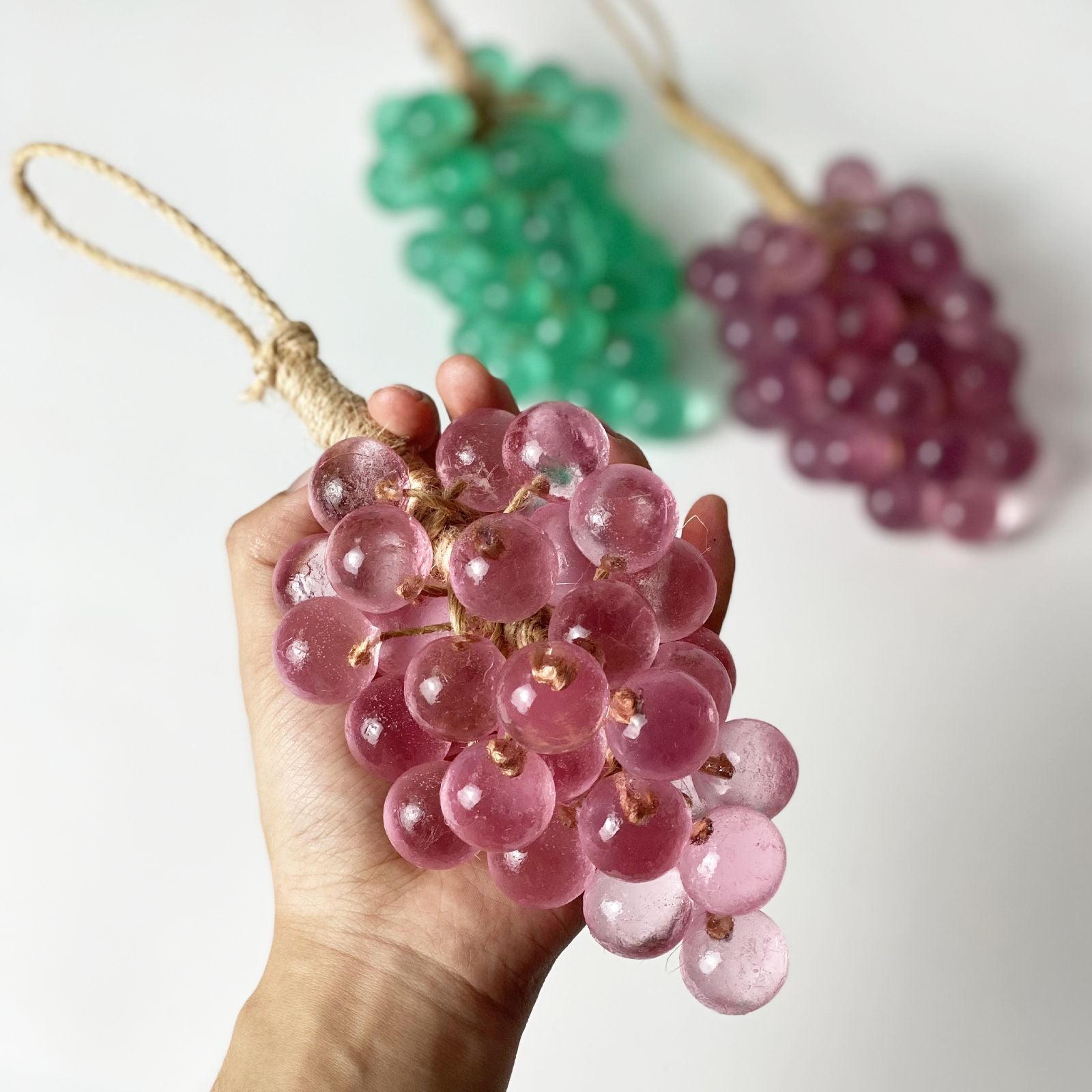 Transparent emerald green crystal grape cluster with white organza bow and twine loop
