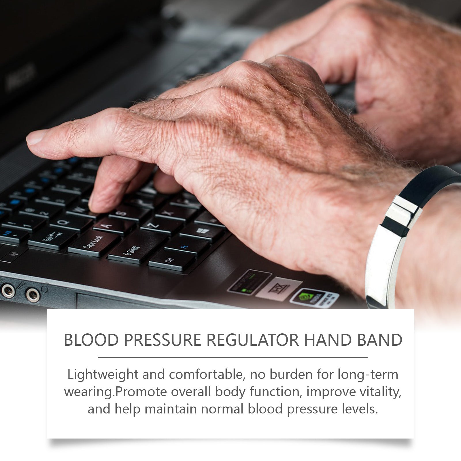 Close-up of hand wearing band while typing at computer keyboard