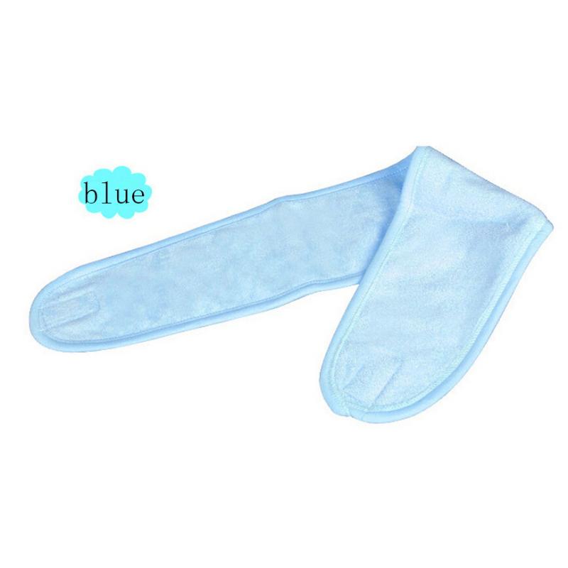 Pink headband laid flat on white background with color label