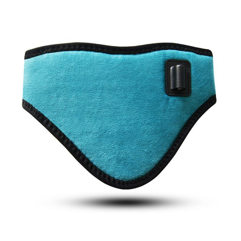 Close-up of turquoise heating wrap showing textured velvet surface and rubberized control button