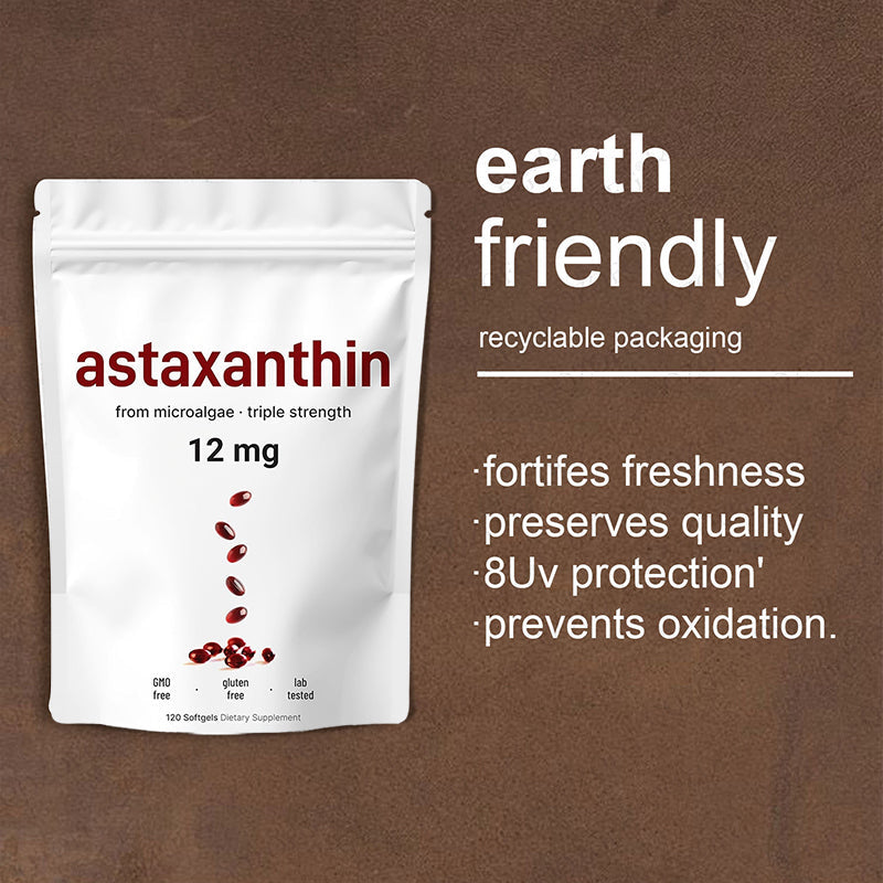 Close-up lifestyle shot: manicured hand holding a single dark red softgel capsule, with large almond positioned to the left for size comparison; text overlay reads 'easy to swallow'