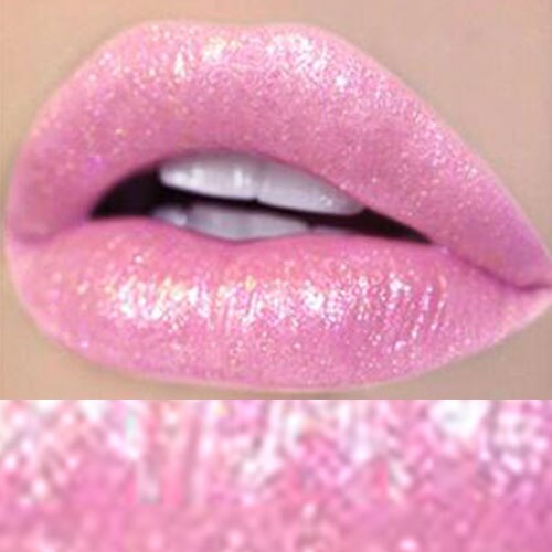 Woman with blonde hair wearing dusty mauve glitter lipgloss in close-up showing sparkling finish