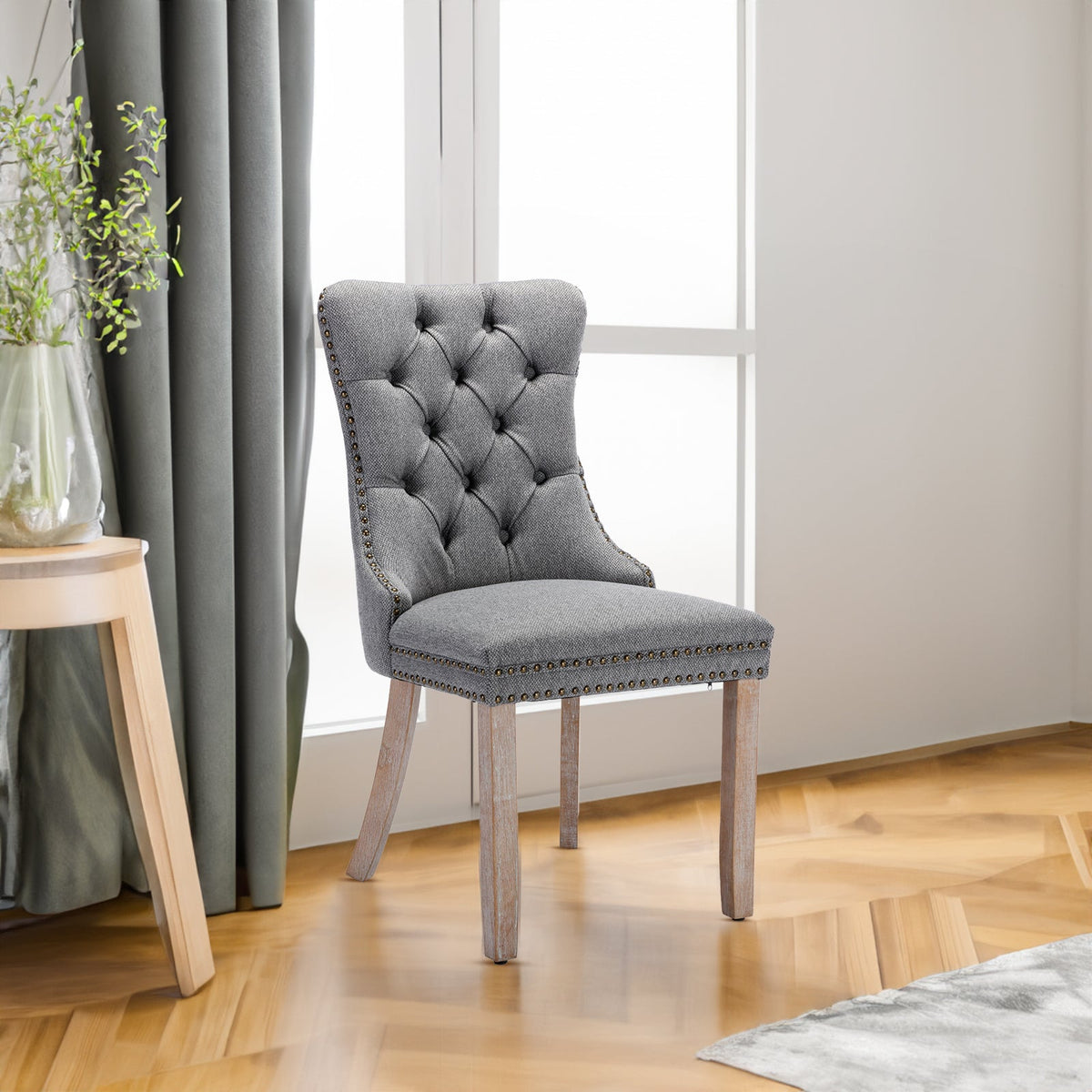 Tufted Grey Linen Dining Chair with Brass Nailhead Trim