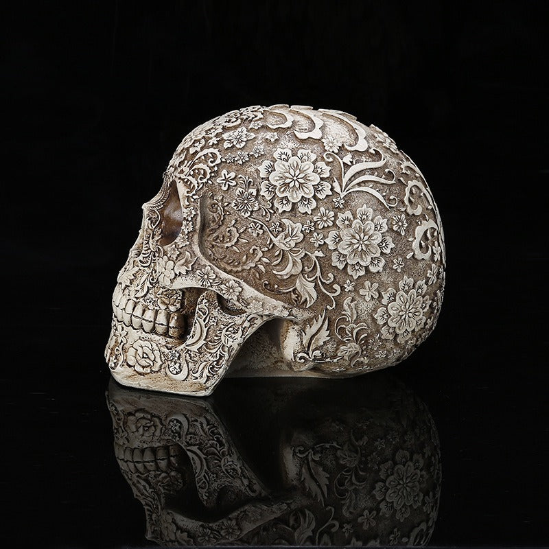 Carved Skull Sculpture with Antique Floral Relief Decor