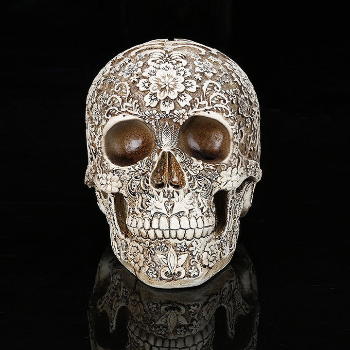 Carved Skull Sculpture with Antique Floral Relief Decor