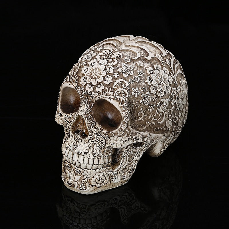 Carved Skull Sculpture with Antique Floral Relief Decor