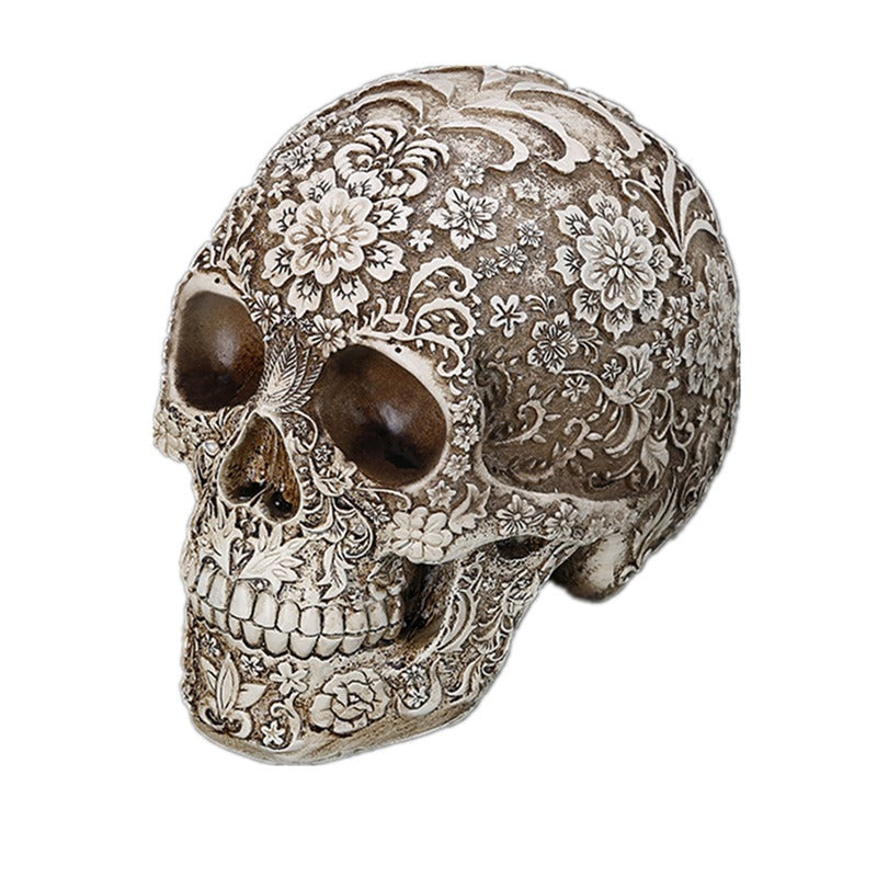 Carved Skull Sculpture with Antique Floral Relief Decor