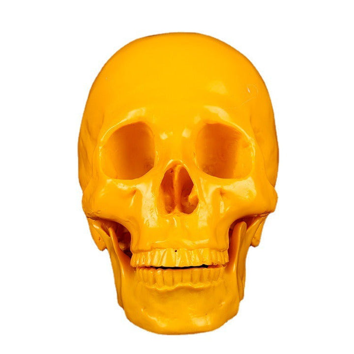 Yellow Resin Skull Ornament | Glossy Anatomical Decor
