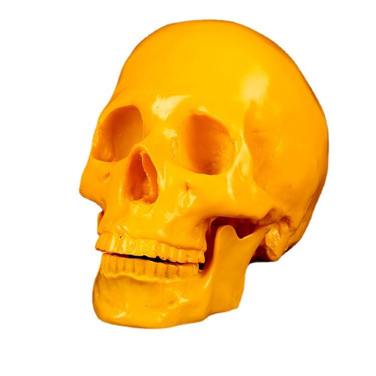 Yellow Resin Skull Ornament | Glossy Anatomical Decor